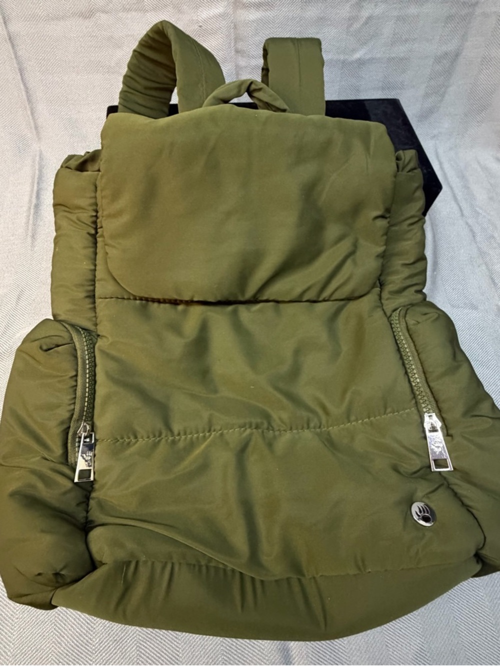 Bearpaw puffy quilted backpack in olive color top open laptop, two side pockets